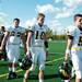 Macomb Lutheran North junior quarterback Jonah Taykowski (middle) and teammates react to losing to Father Gabriel Richard 24-10 on saturday. Daniel Brenner I AnnArbor.com